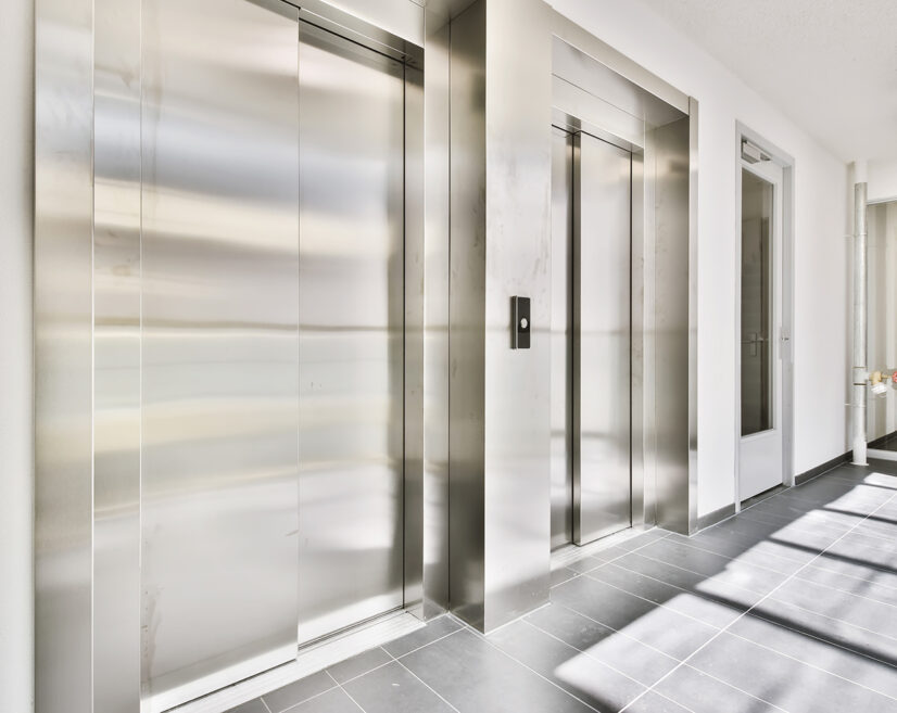 Stylish metal elevator in cozy high-rise building