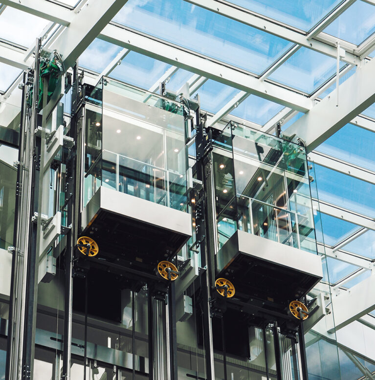Modern elevator glass cabins in a contemporary business center
